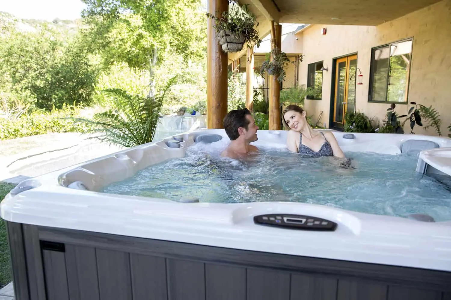 hot tub oasis - a young couple relaxing in the hot tub after work